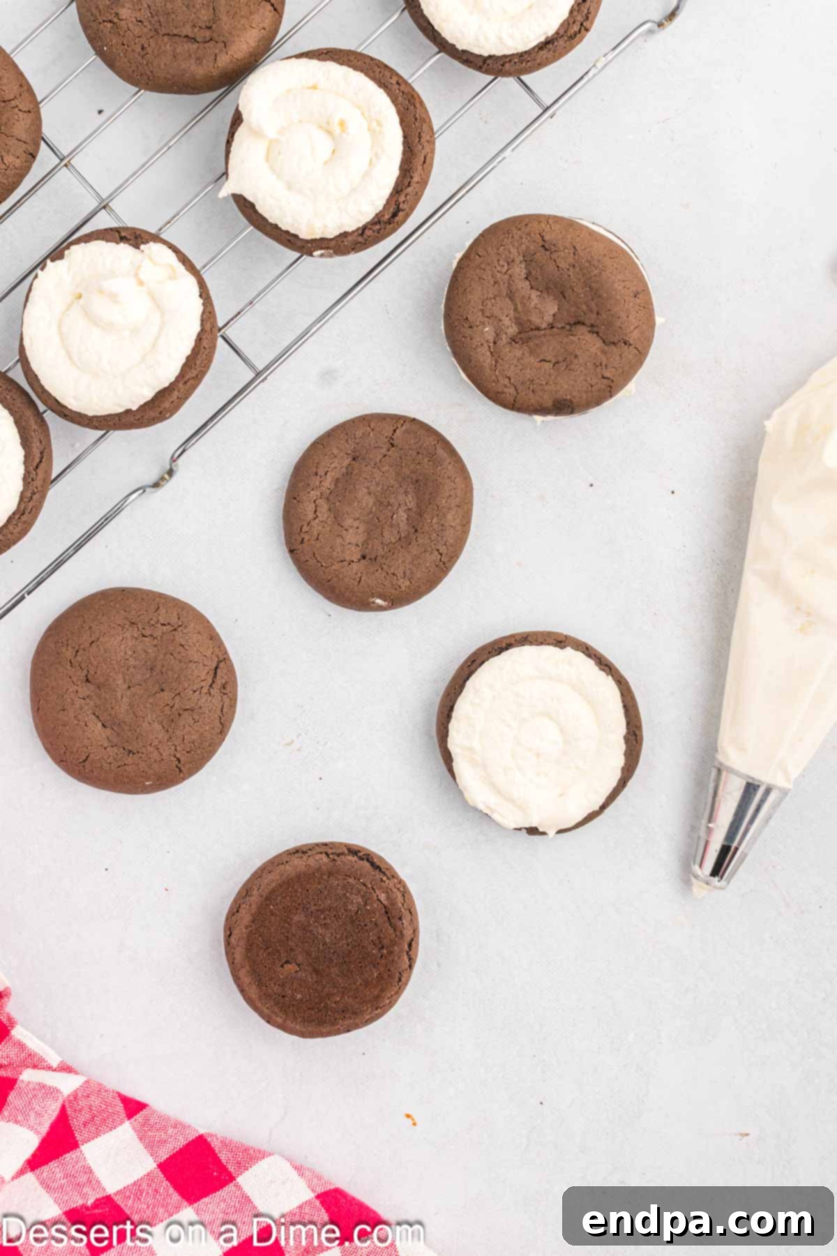 Frosting piped on each cookie to make a sandwich.