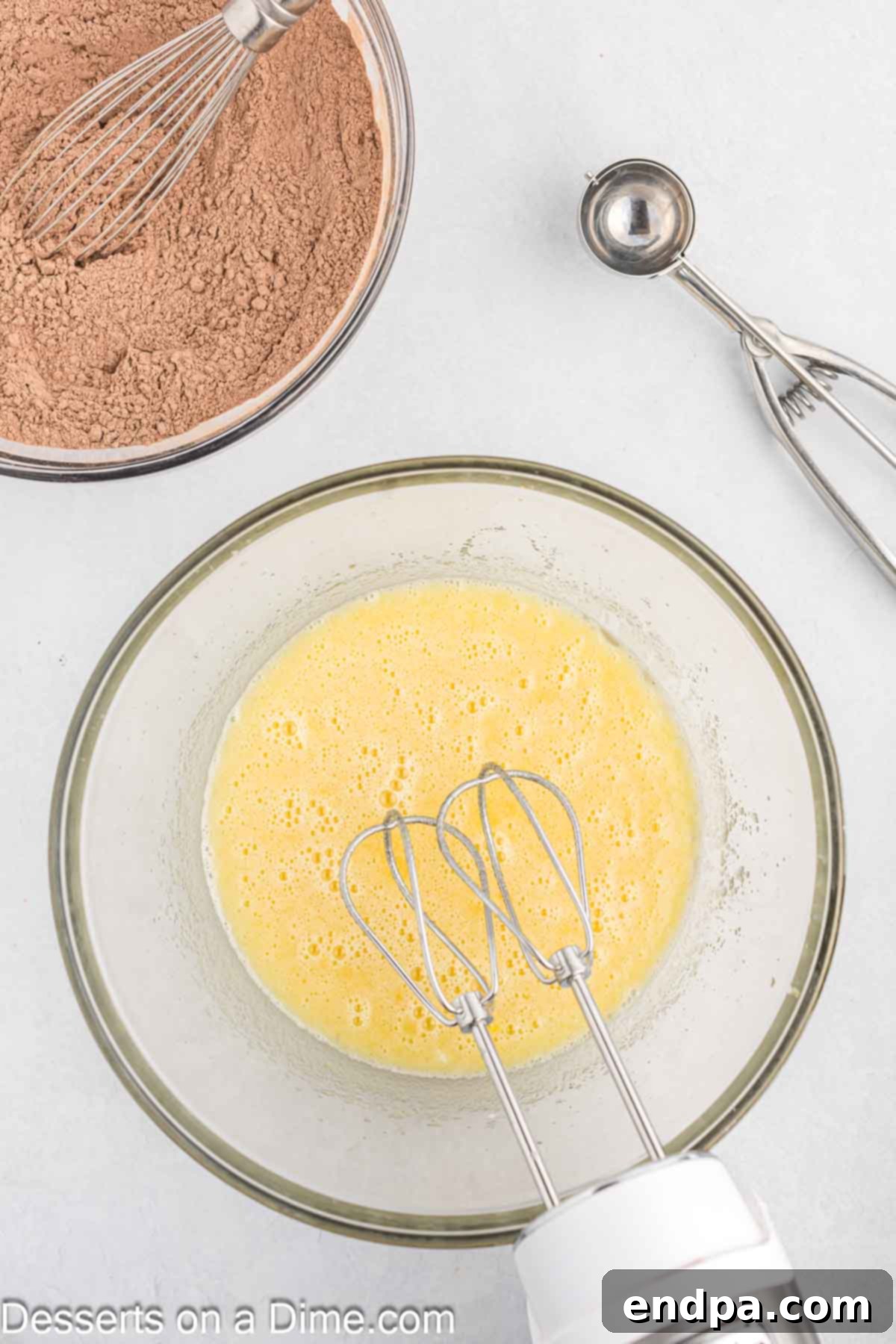 Eggs, milk and vanilla added to bowl.