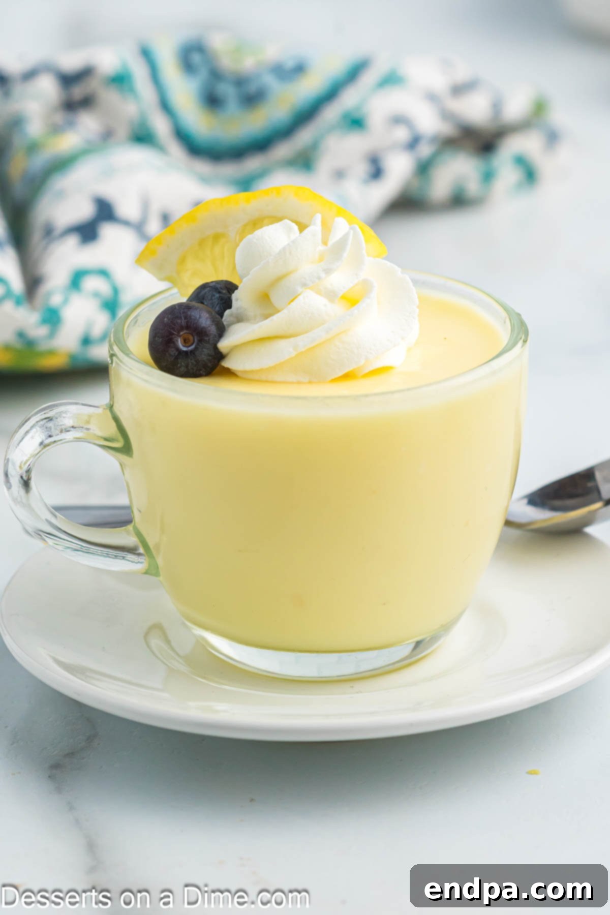 Cup of lemon pudding on a plate. 