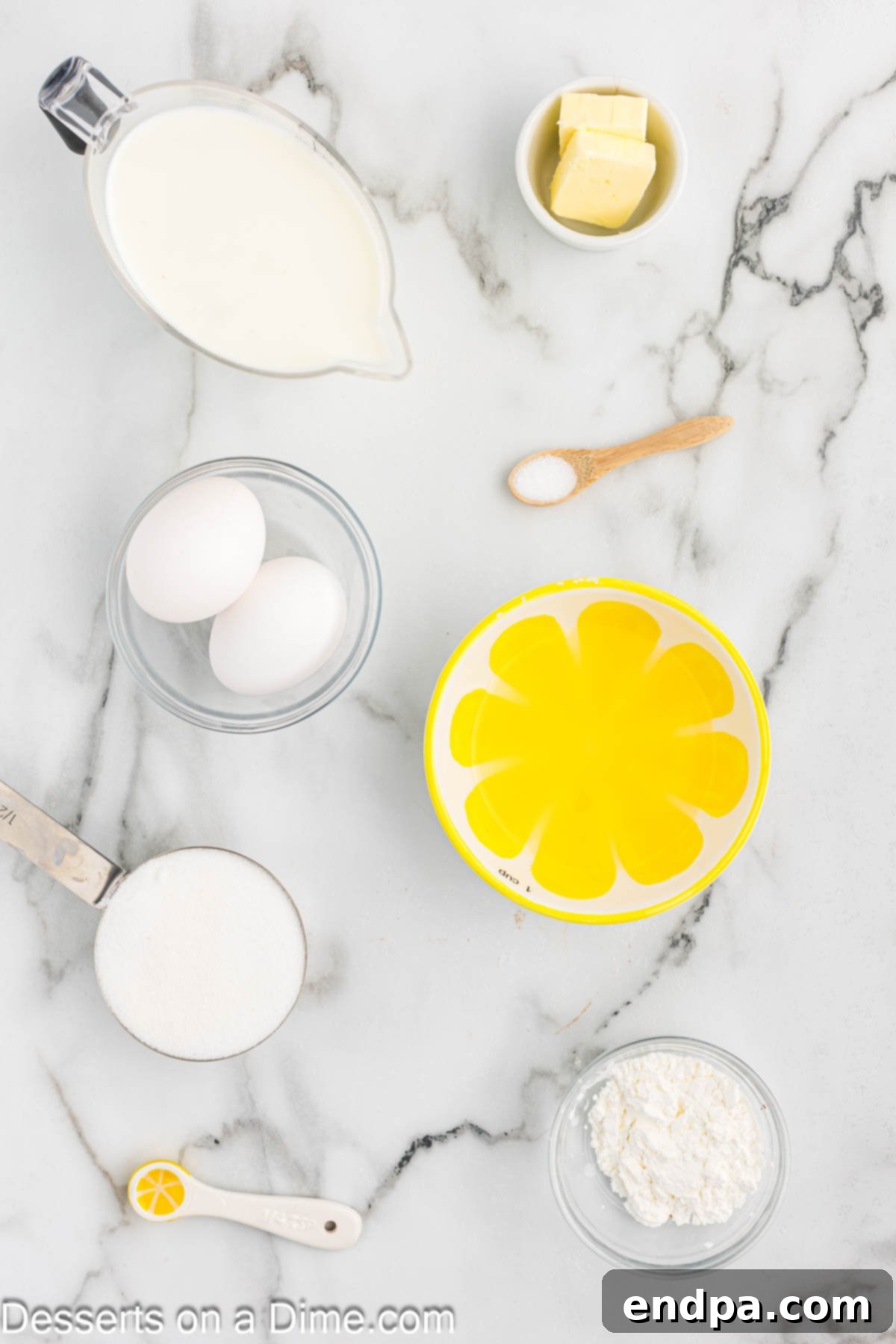 Ingredients for recipe - cornstarch, whole milk, lemon juice, lemon extract, powdered sugar, zest. 