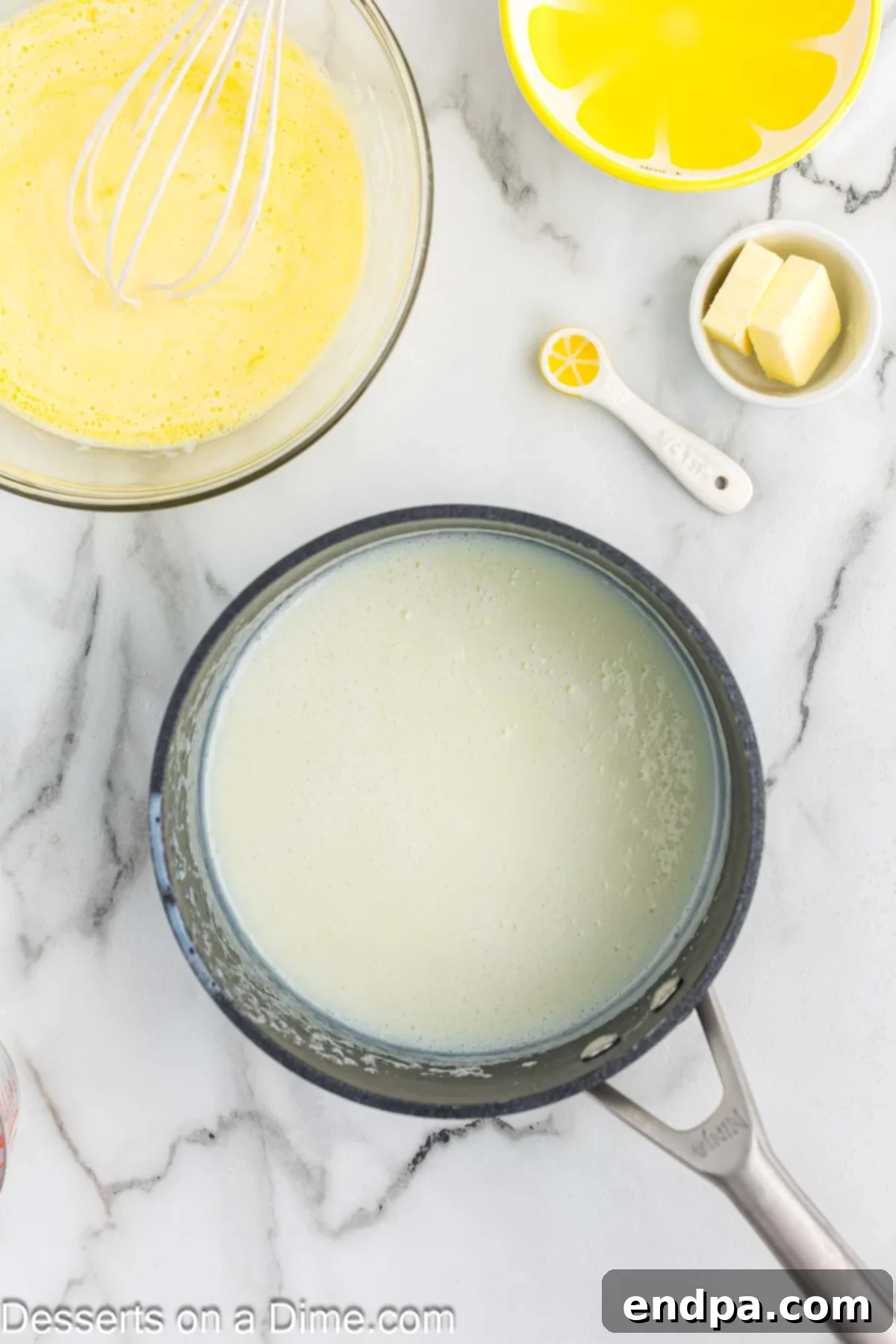 Milk whisked into saucepan. 