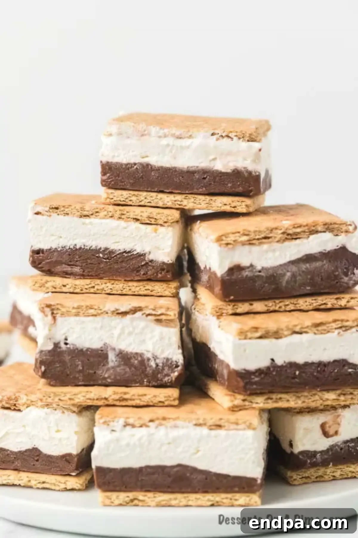 Smores Freeze 11 Frozen S'mores stacked on a plate, ready to be enjoyed.