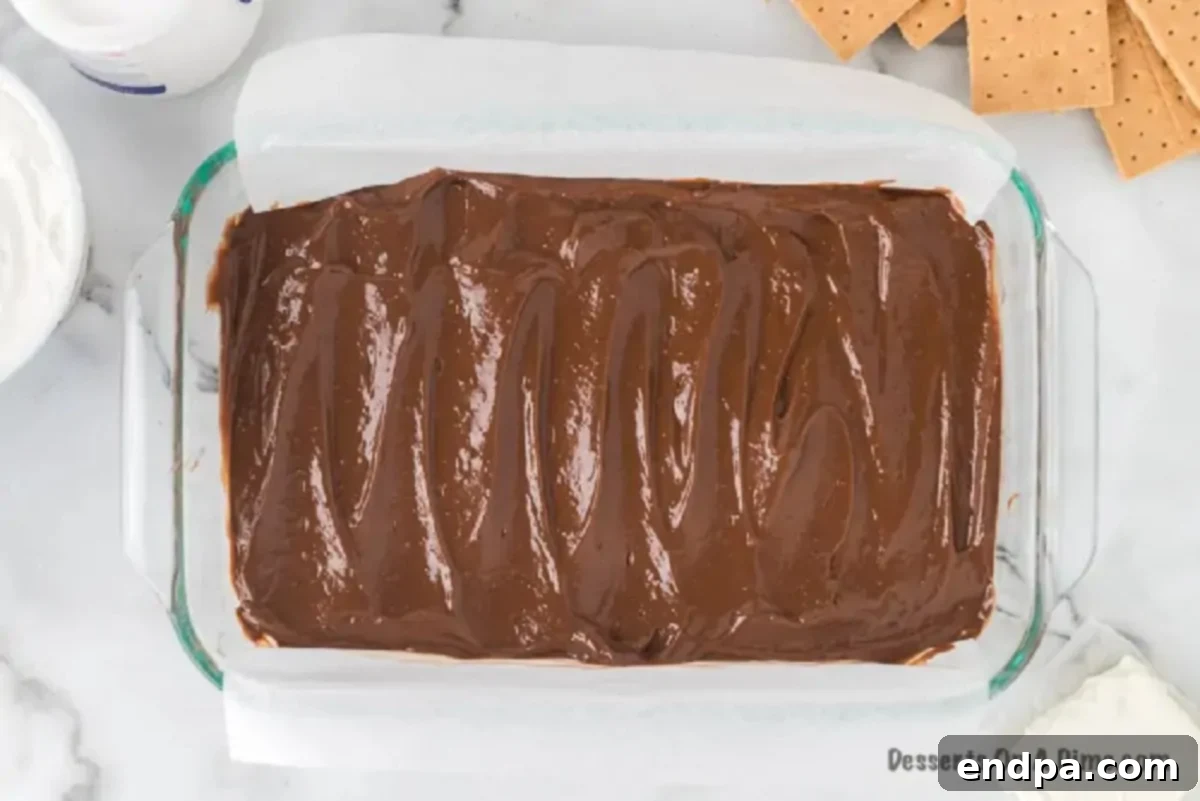 Smores Freeze 4 Chocolate pudding mixture spread evenly in a baking pan.