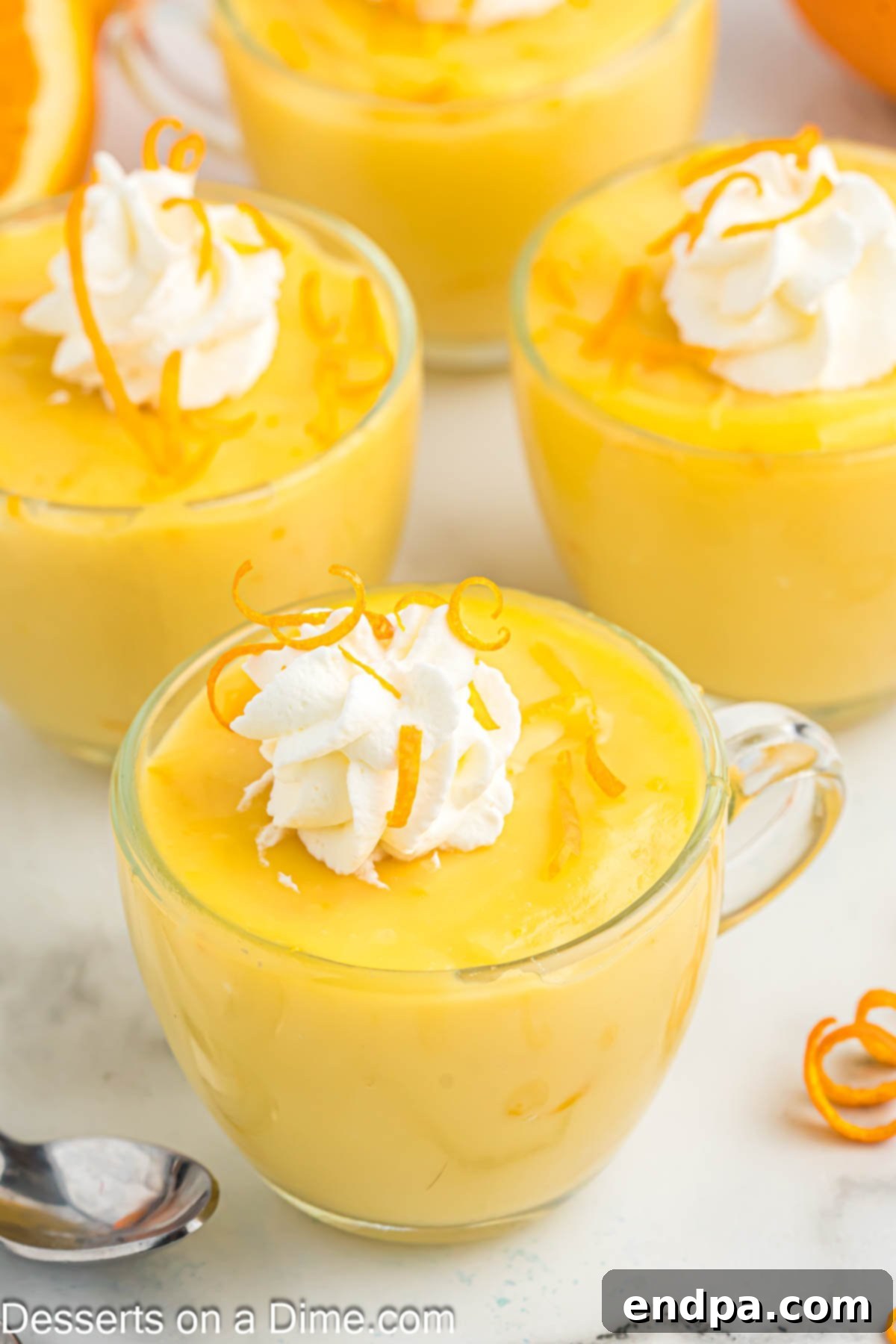 Pudding in cups with whipped cream.