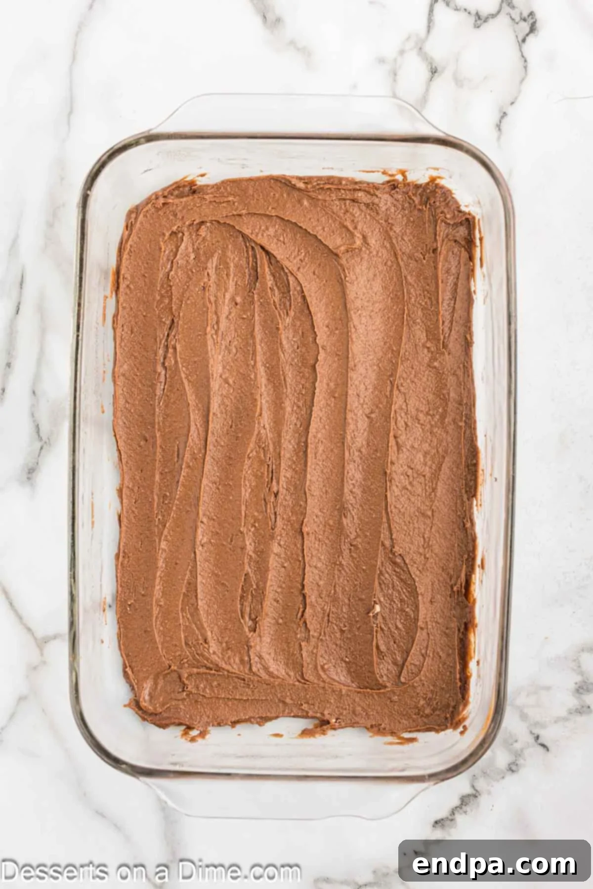 Decadent French Silk Brownies 5 Brownie mix spread in baking dish.