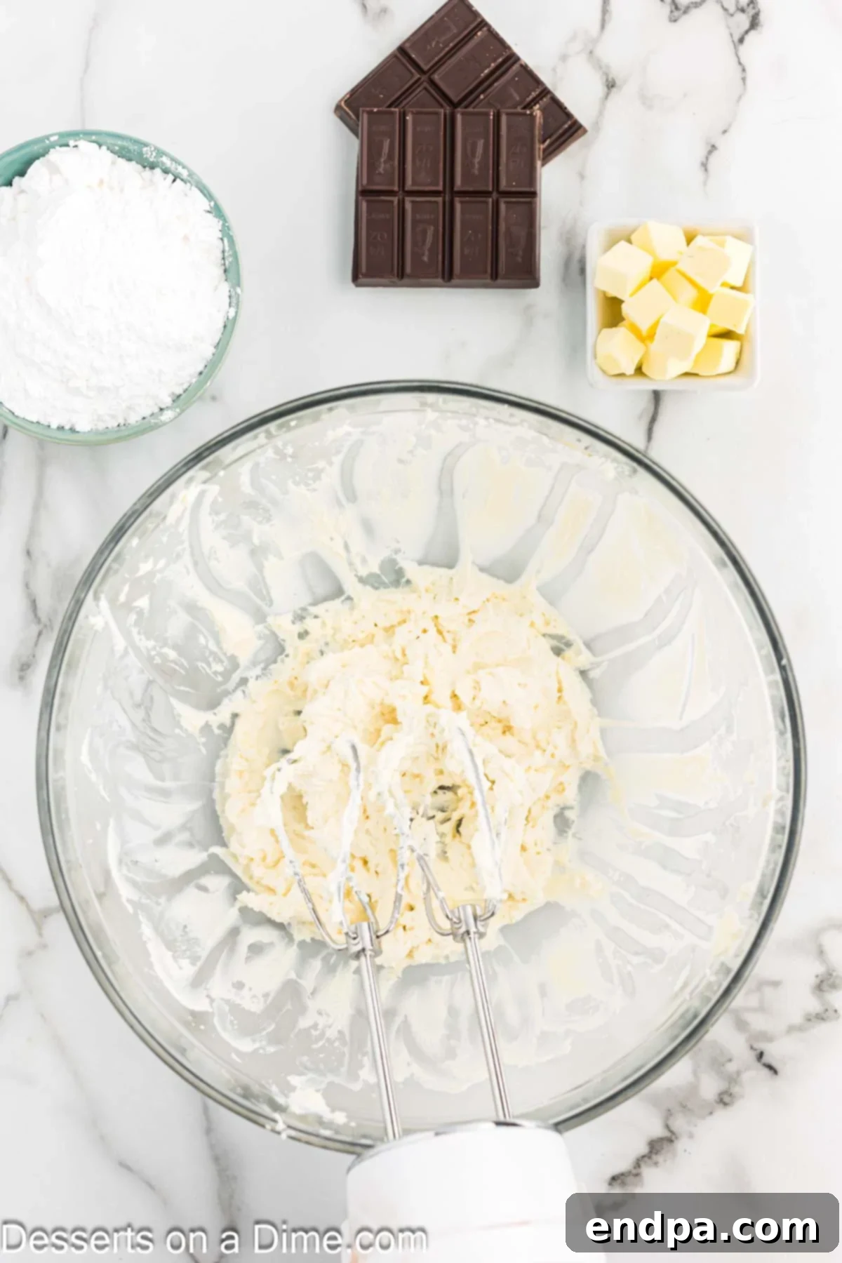 Decadent French Silk Brownies 7 Cream cheese and vanilla combined in a bowl.