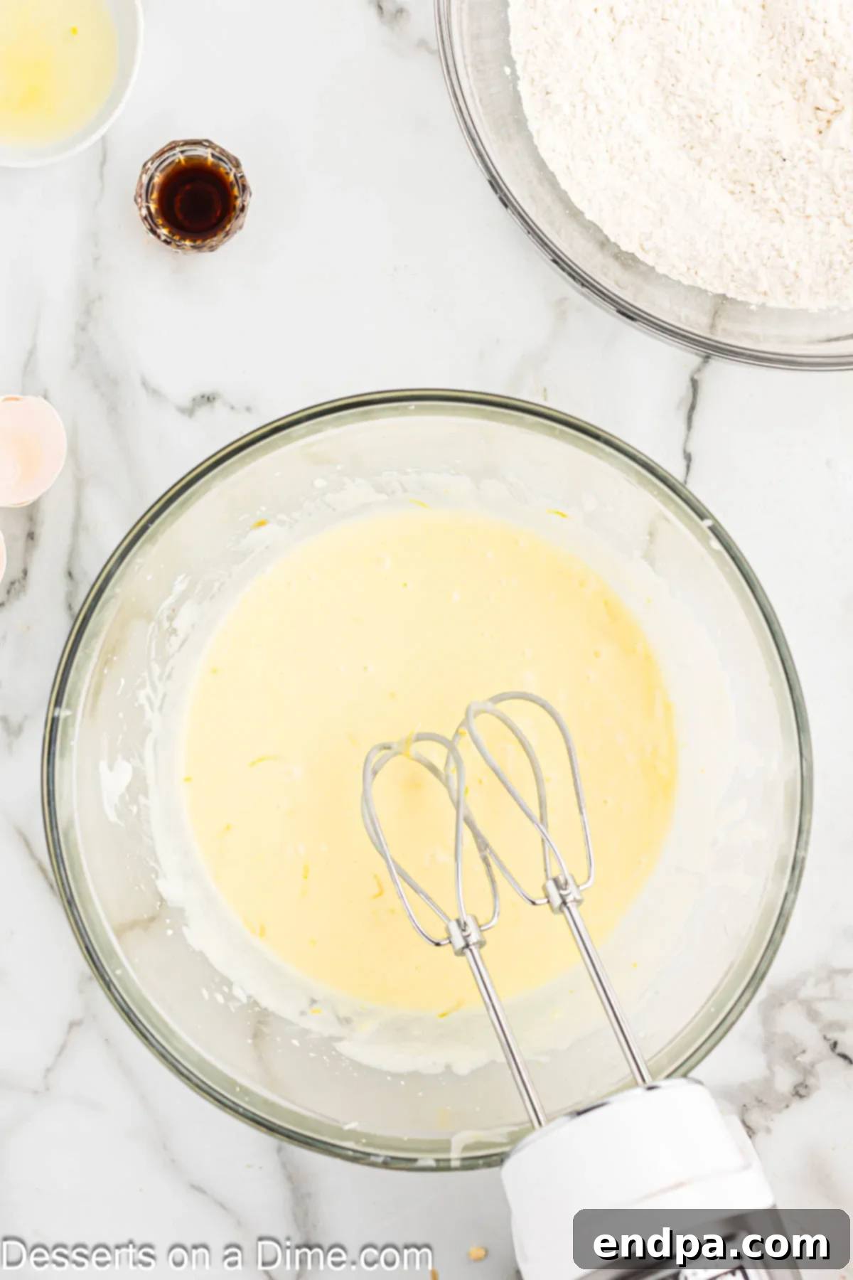 Mixing bowl with egg mixture and liquid flavorings.