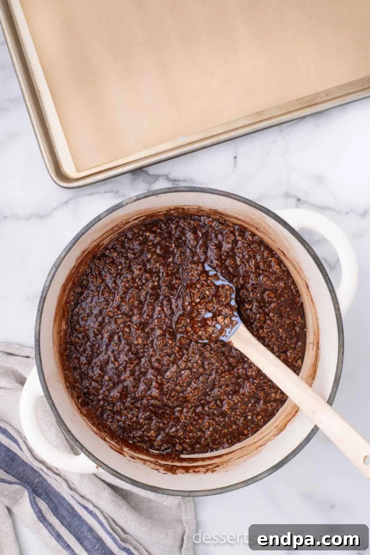 The cookie mixture fully combined with oats, showing a thick, cohesive texture.