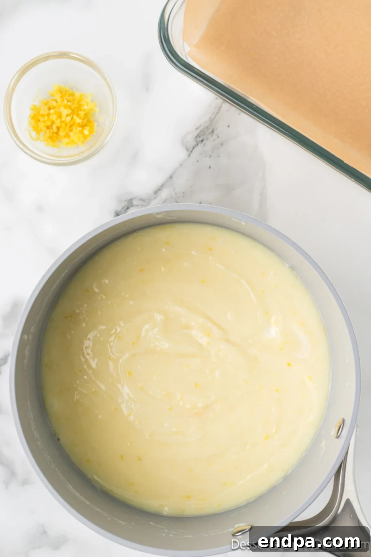 The lemon and white chocolate mixture smoothly combined and melted.