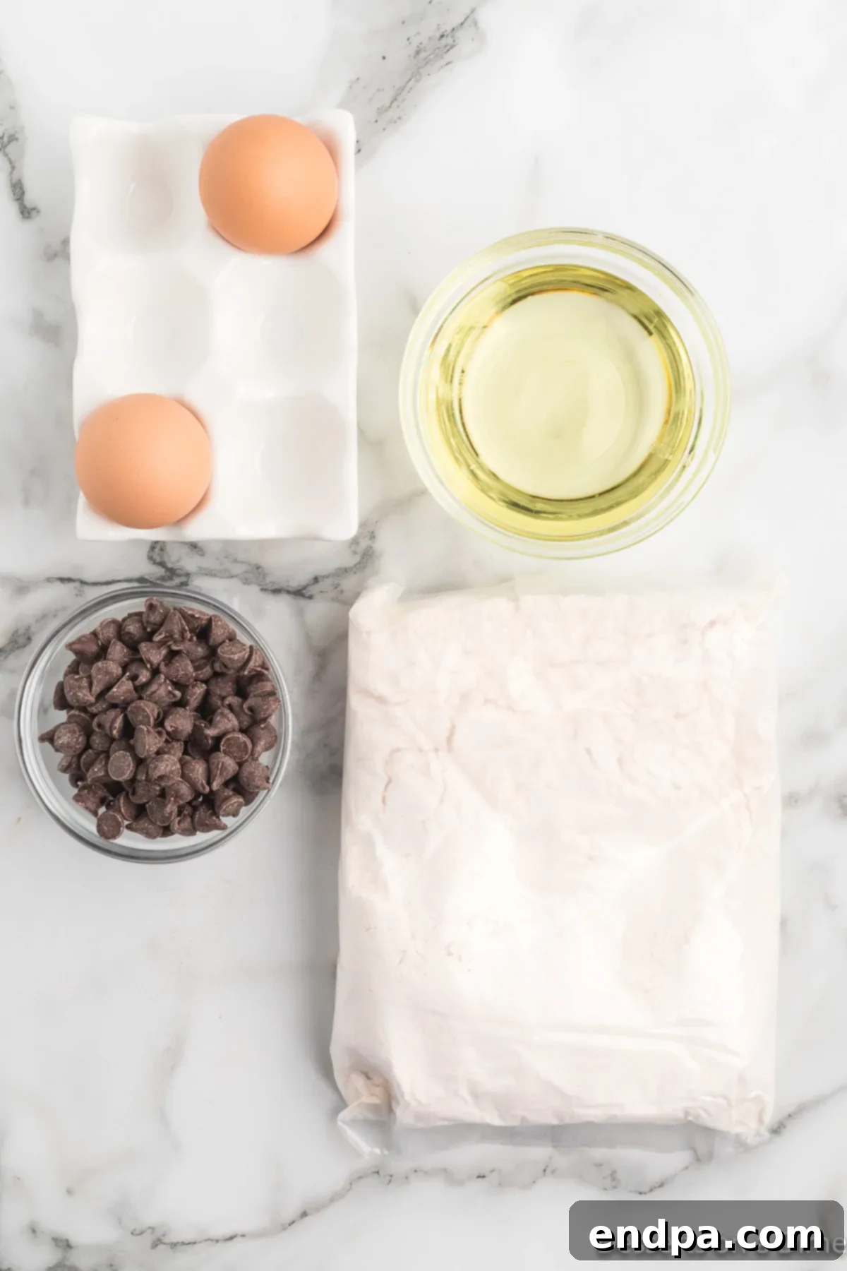 Irresistible Chocolate Chip Cake Mix Cookies 3 Ingredients for Chocolate Chip Cake Mix Cookies: a box of yellow cake mix, vegetable oil, eggs, and a bag of semi-sweet chocolate chips.