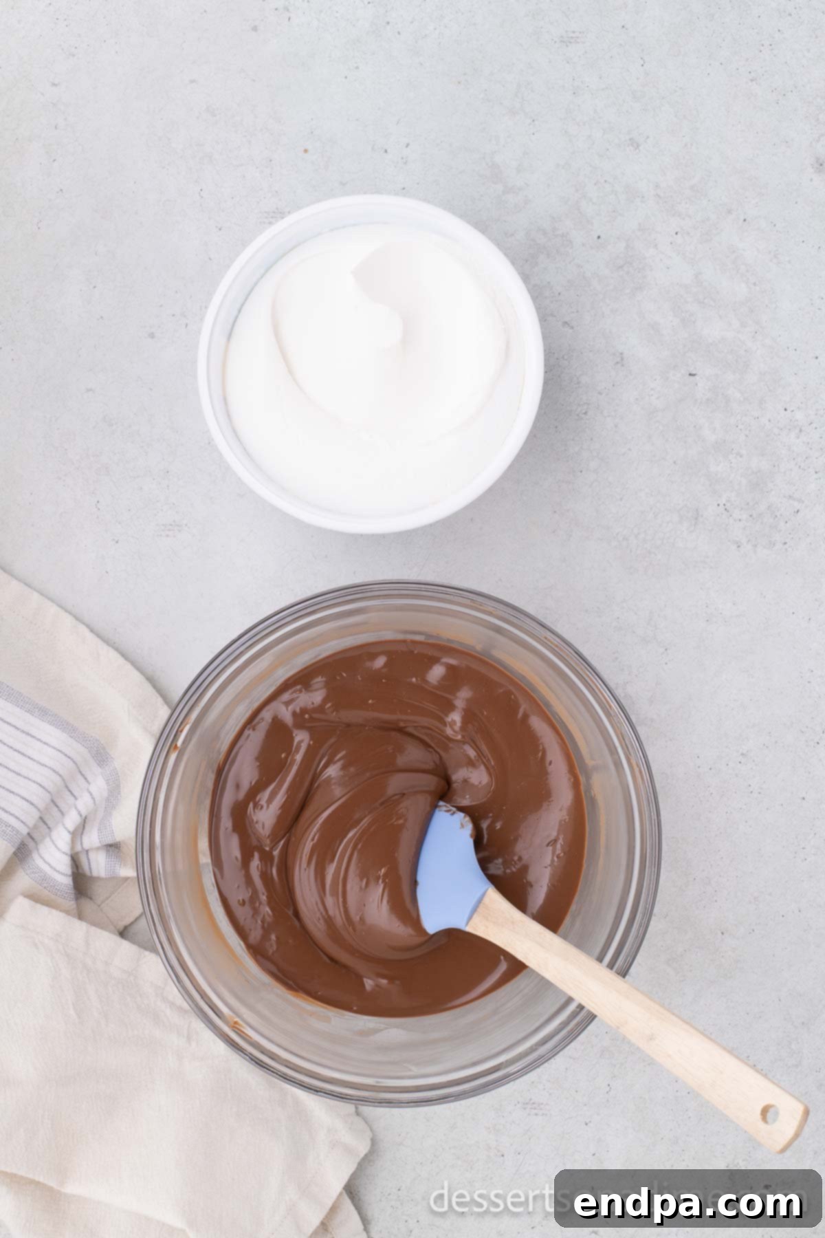 Melted chocolate chips in a bowl, smooth and glossy.
