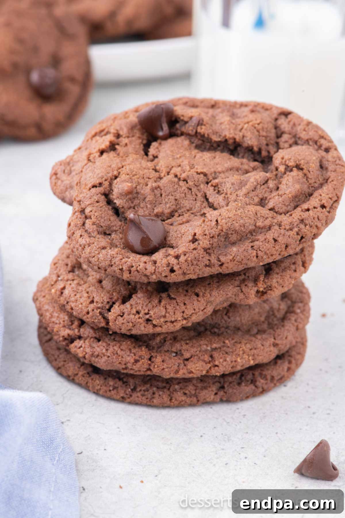 A stack of perfectly baked Nutella Cookies, showcasing their soft texture and visible chocolate chips, ready to be enjoyed.