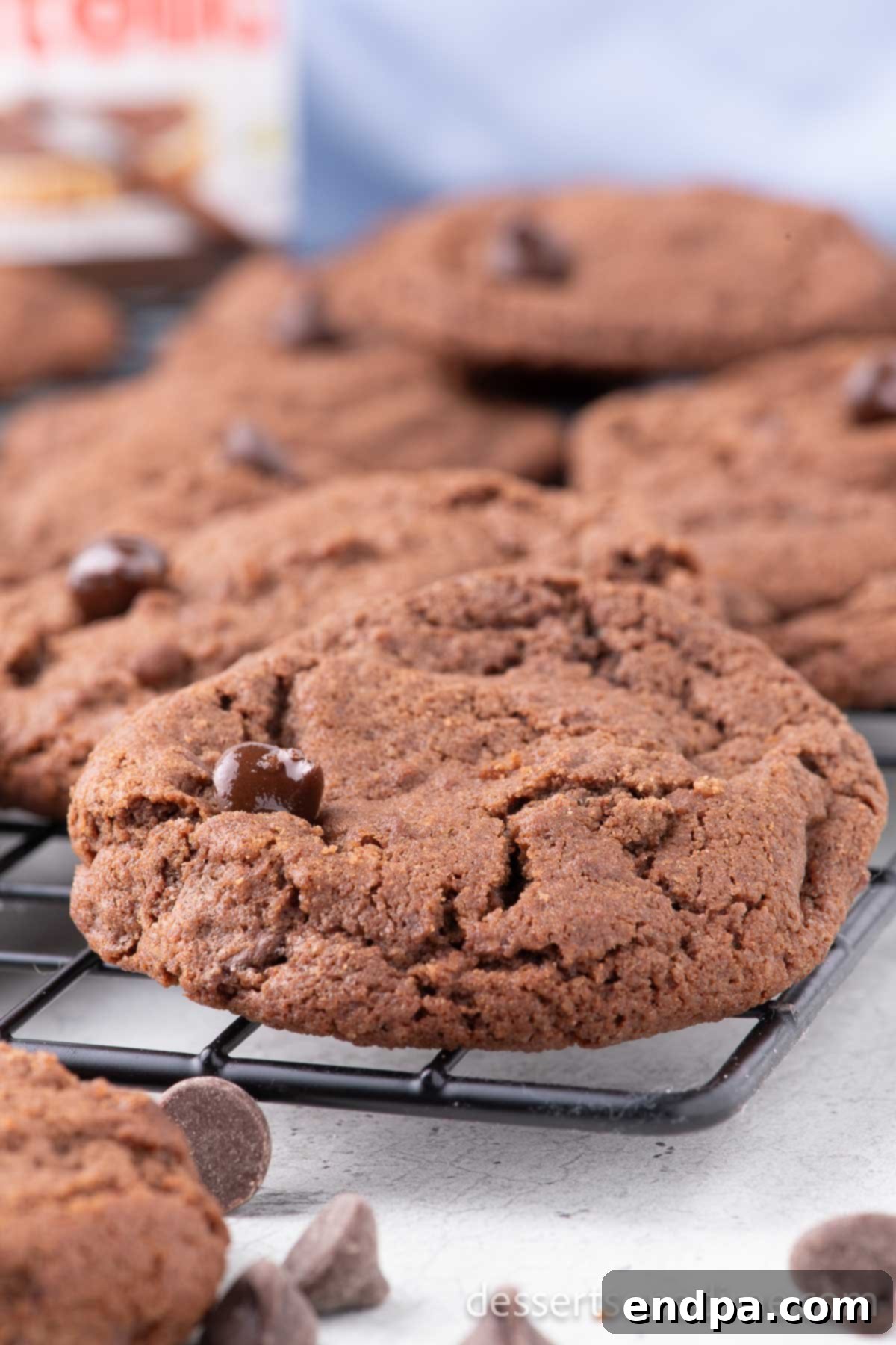 Freshly baked Nutella cookies cooling on a wire rack, showcasing their irresistible chocolate hazelnut appeal.