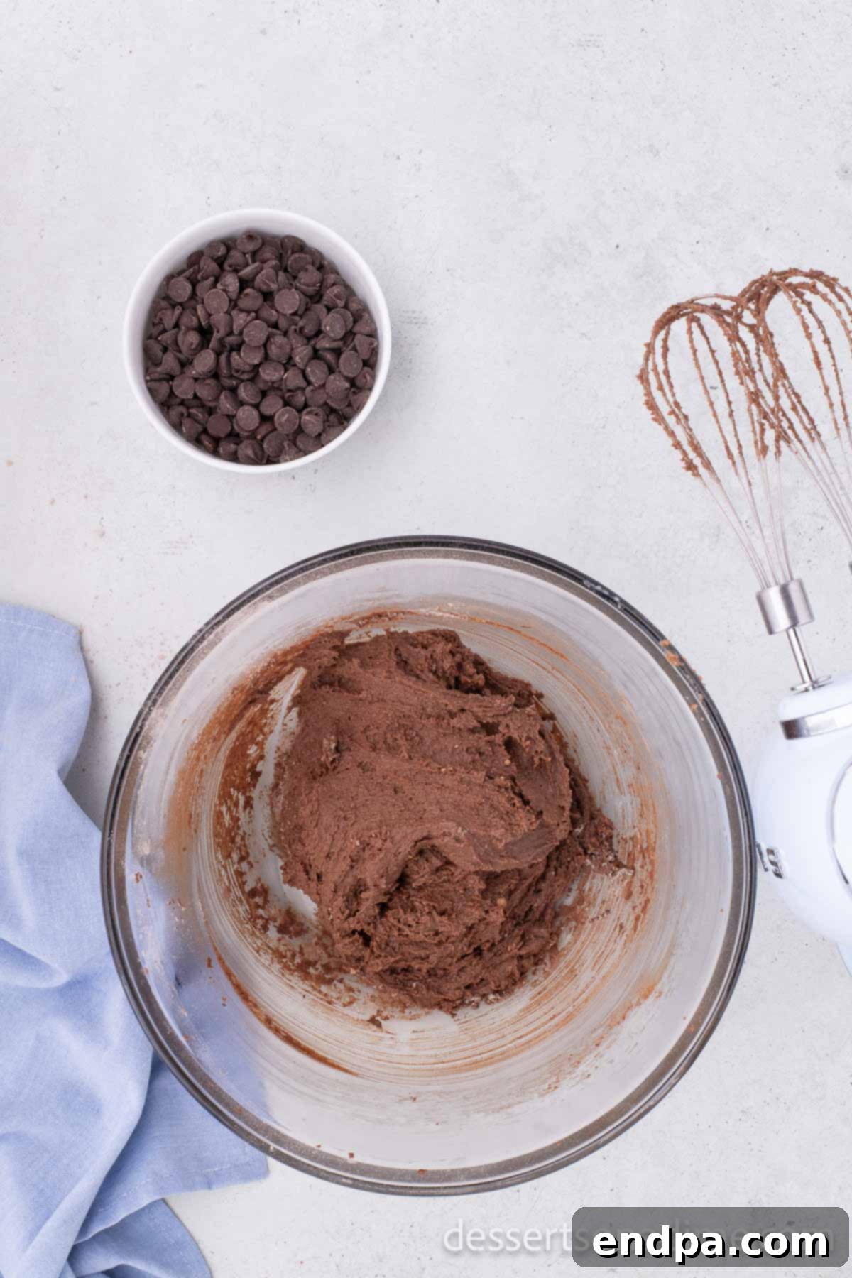 The fully combined Nutella cookie dough in a mixing bowl, smooth and ready for the final additions.