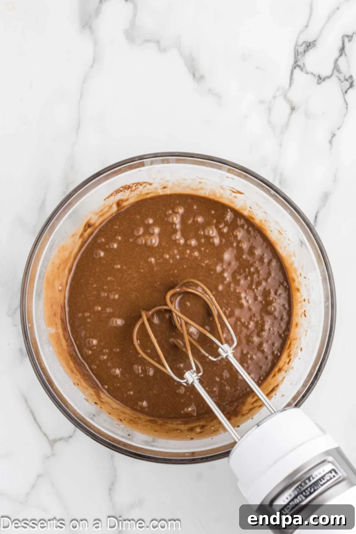 Texas Sheet Cake Minis 6 Additional ingredients like buttermilk, eggs, and vanilla extract being added to the chocolate cake mixture.