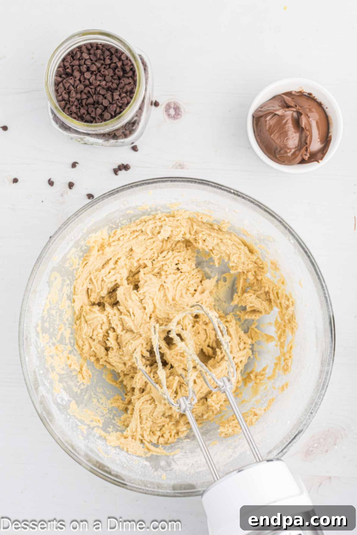 Decadent Nutella Bars 6 Dry ingredients (flour, salt, baking powder) being mixed into the wet ingredients on low speed.