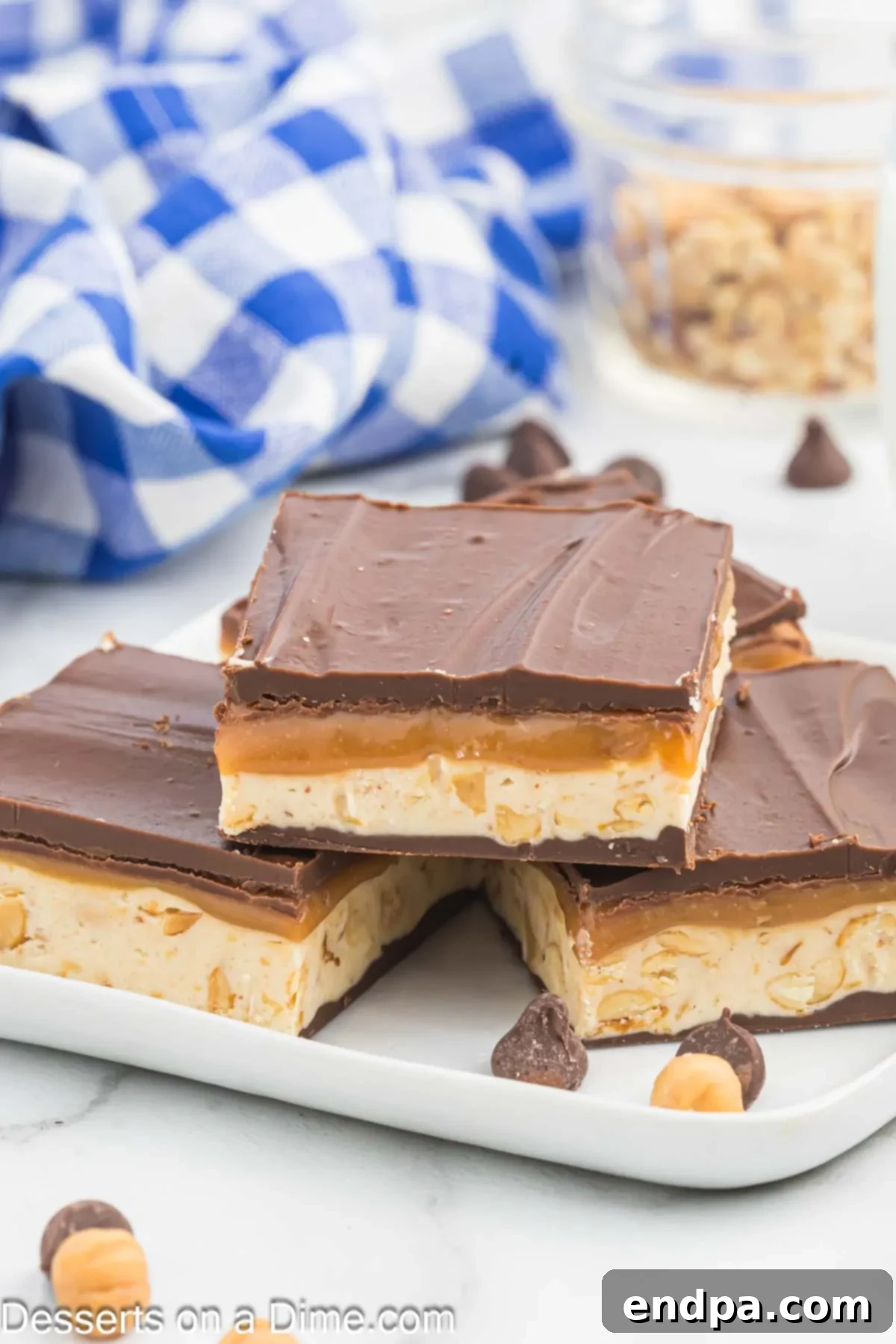 Squares of Homemade Snickers ready to serve.