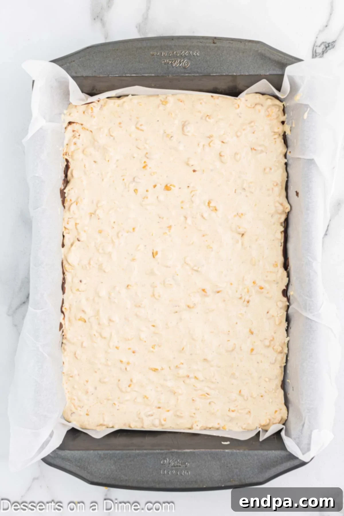 Nougat mixture spread in pan.