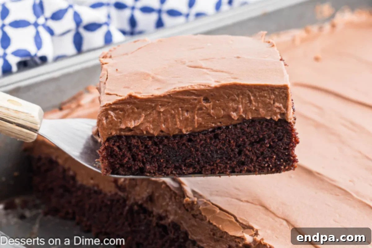 Chocolate Mayonnaise Cake being served on a plate with a fork.