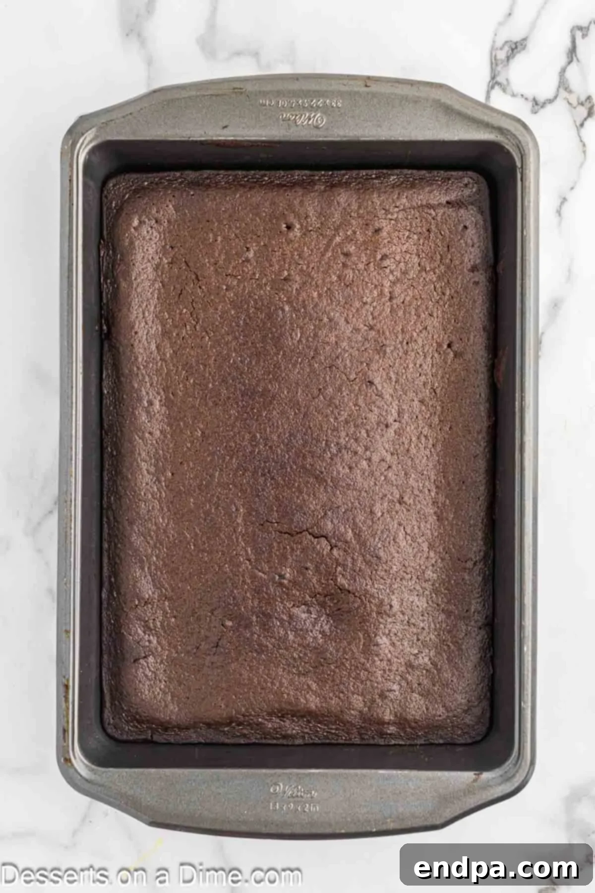 Baked chocolate mayonnaise cake cooling in the pan.