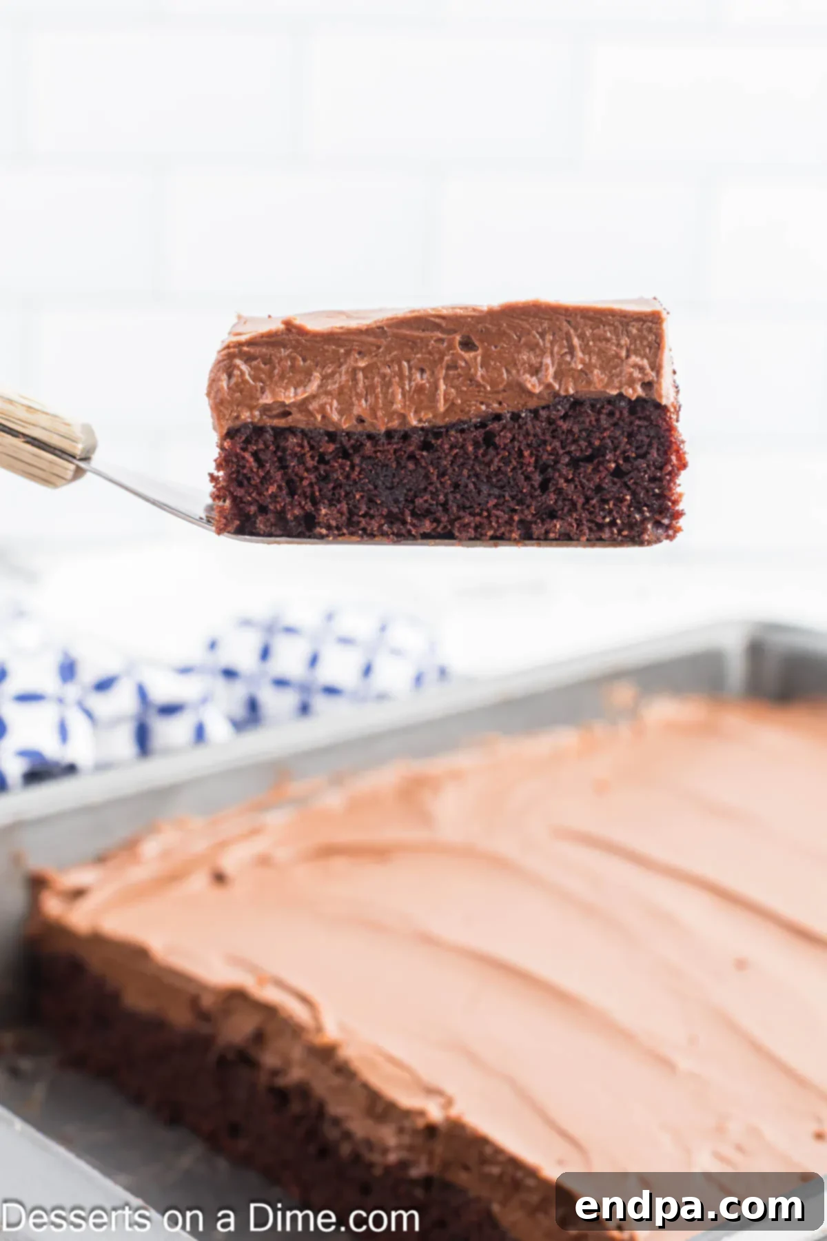 Chocolate mayonnaise cake being sliced into servings.
