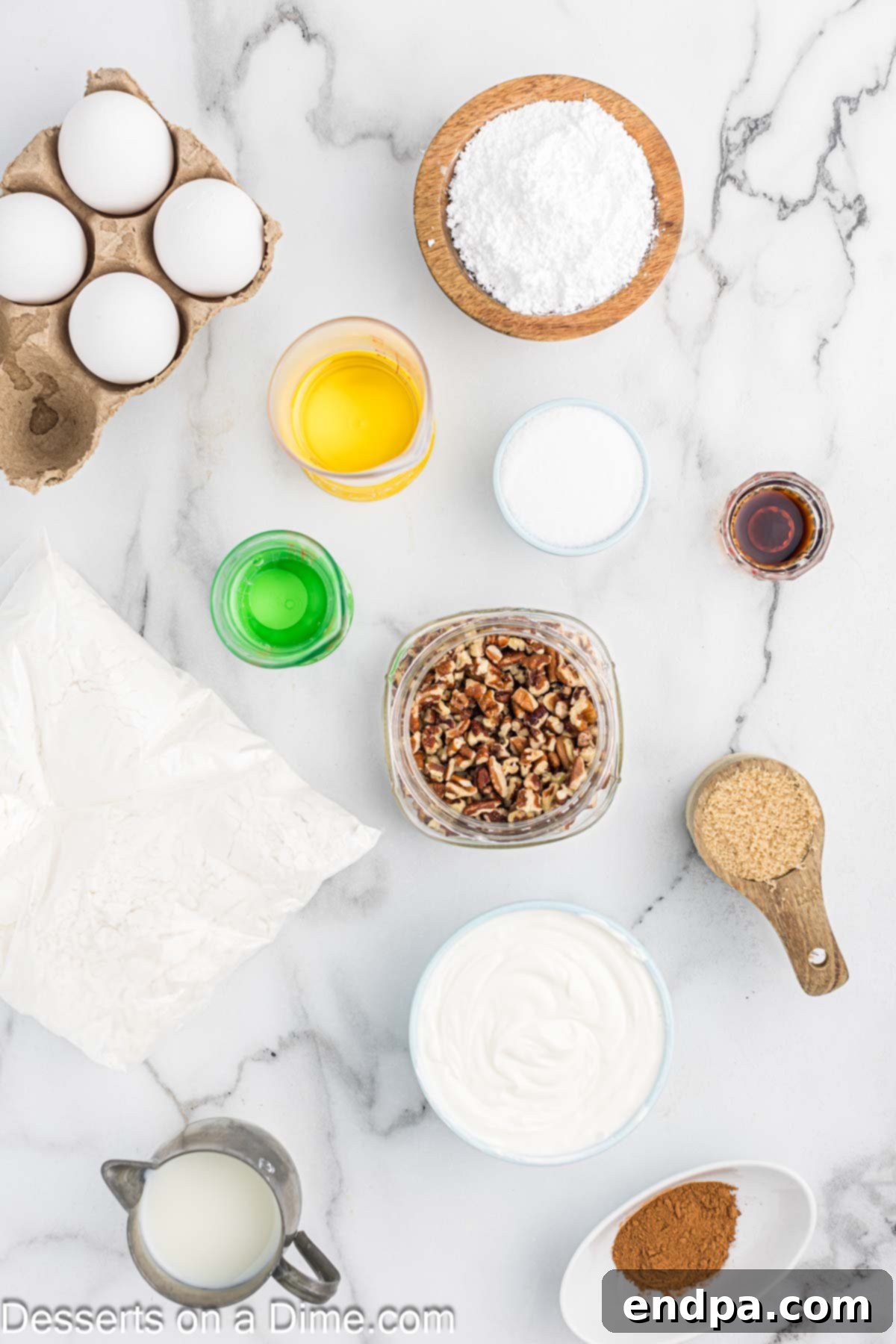 Ingredients for Sock it to Me Cake - cake mix, sour cream, eggs, vanilla, yellow cake mix, brown sugar, pecans, powdered sugar, milk. All items neatly displayed for baking.