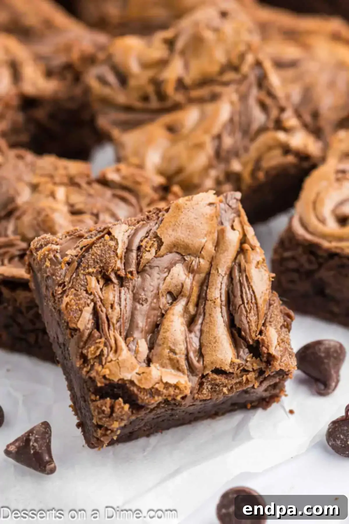 Decadent Nutella brownies cut into perfect squares, showcasing their fudgy texture and beautiful Nutella swirl.