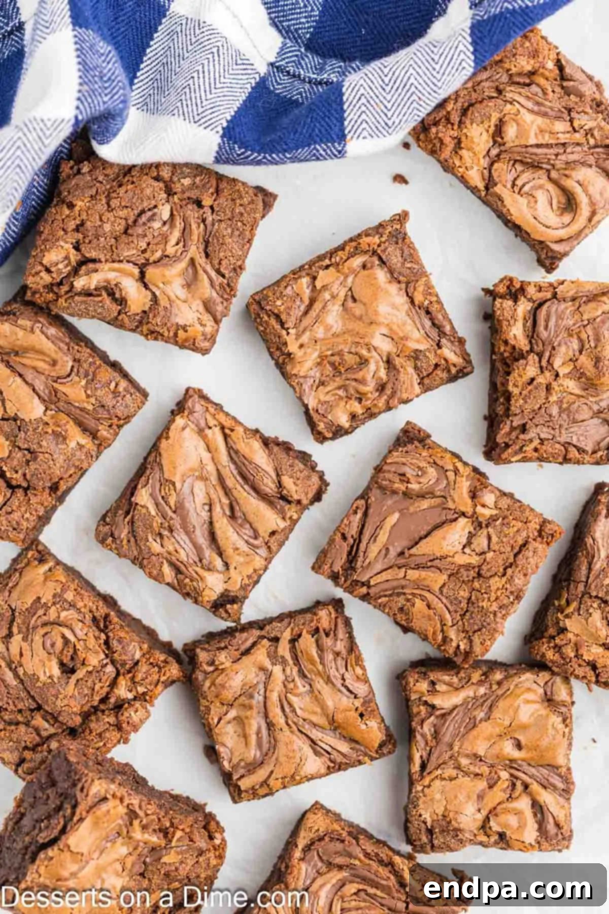 Perfectly cut Nutella brownies arranged on a serving plate, highlighting their rich color and inviting texture.