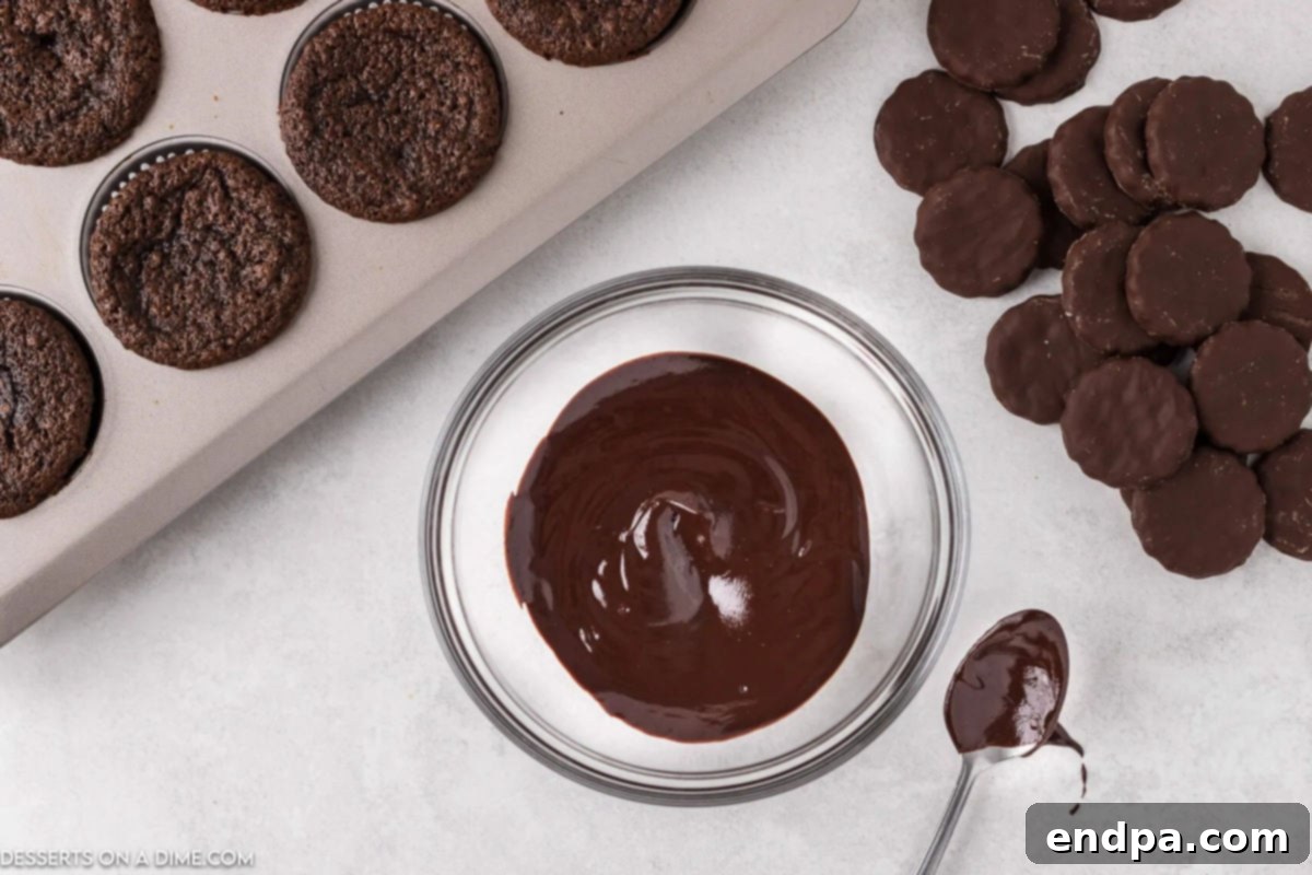 Smooth, melted chocolate ganache in a bowl after being microwaved and stirred.