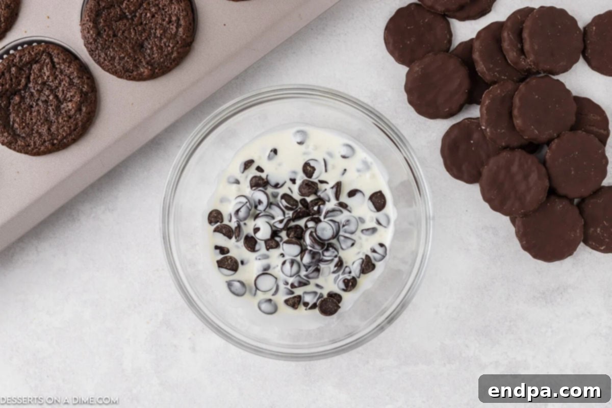 Chocolate chips and heavy whipping cream in a microwave-safe bowl, ready to be heated for ganache.