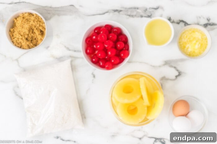 Ingredients needed - pineapple slices, cake mix, oil, eggs, butter, brown sugar, cherries