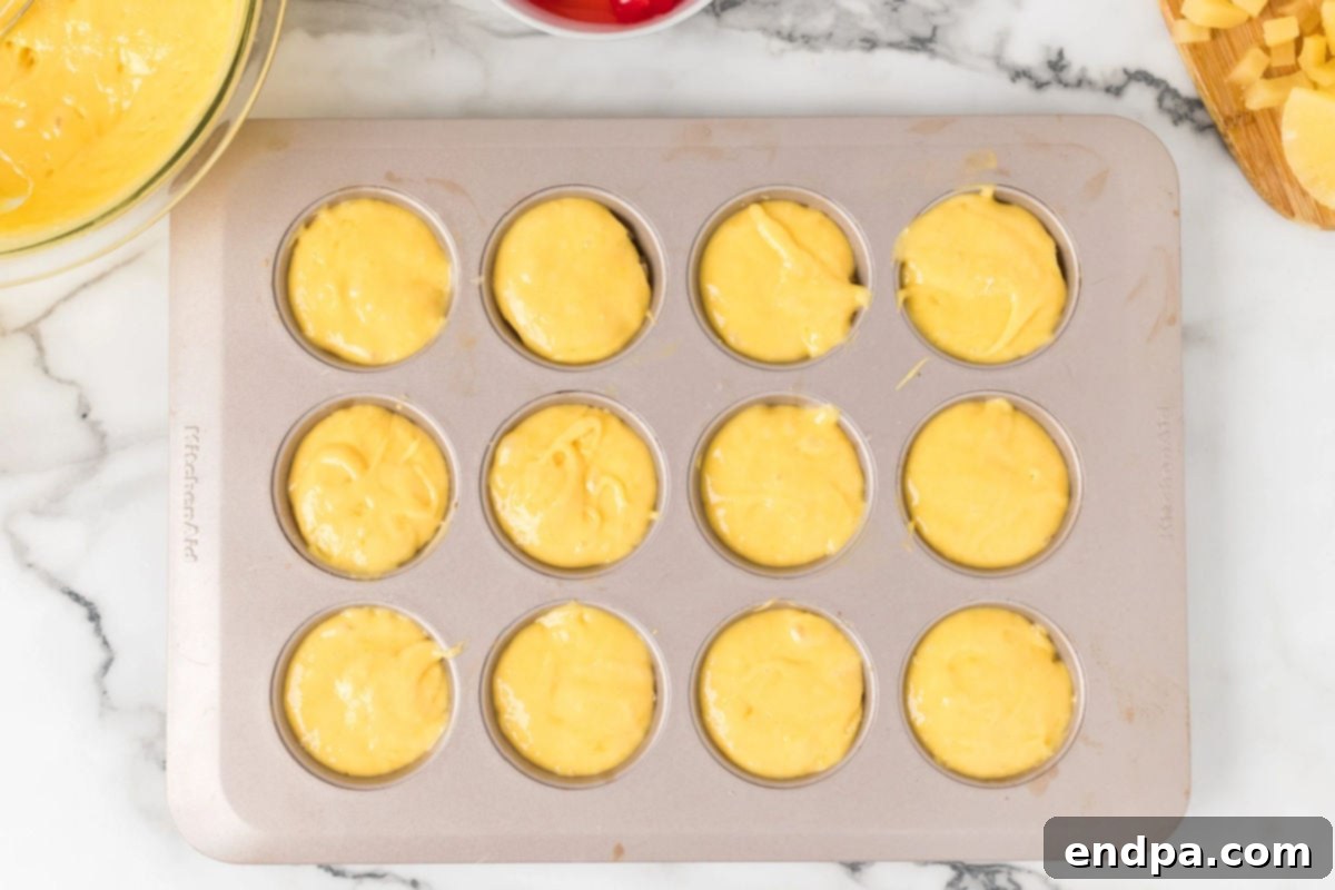 Batter on top of muffin tin.