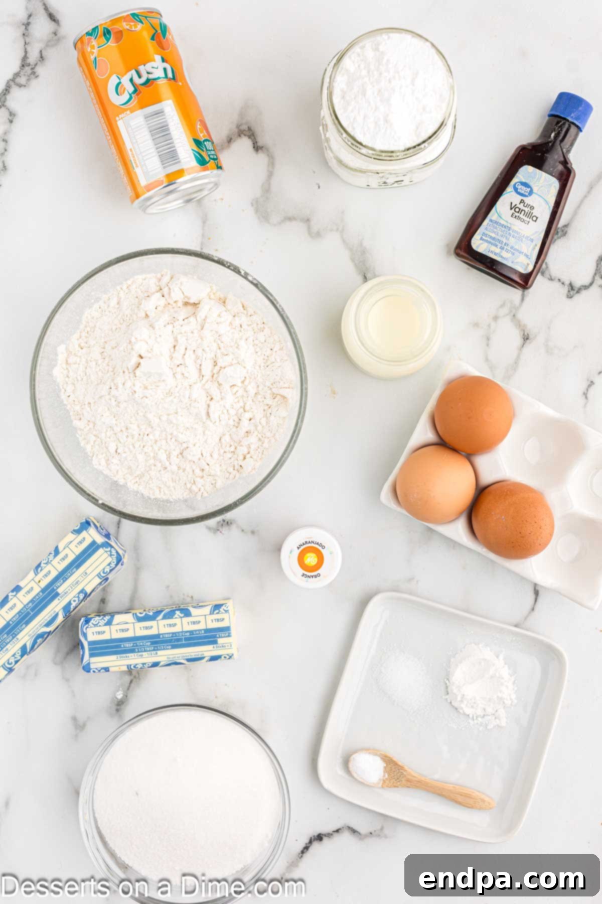 Ingredients for orange cupcakes - all-purpose flour, baking powder, baking soda, vanilla, buttermilk.