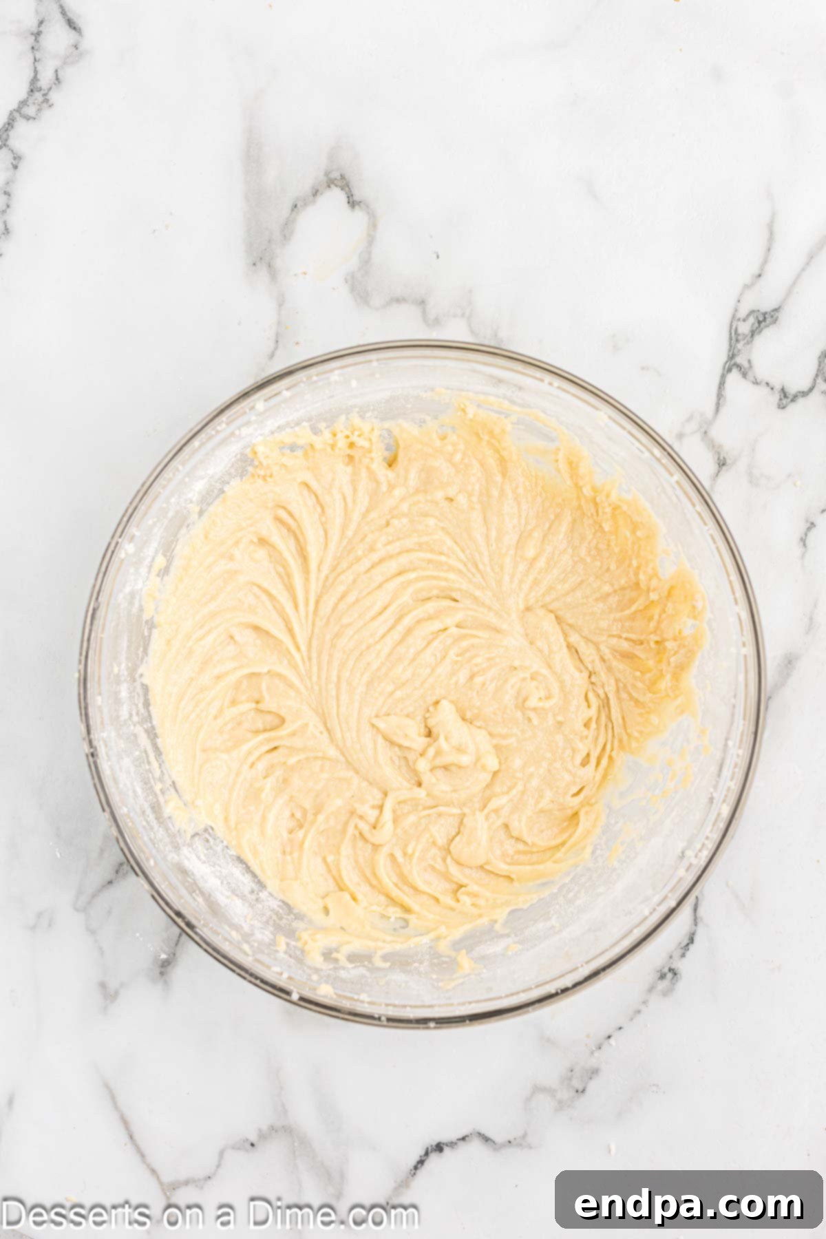 Wet and dry ingredients combined in bowl.