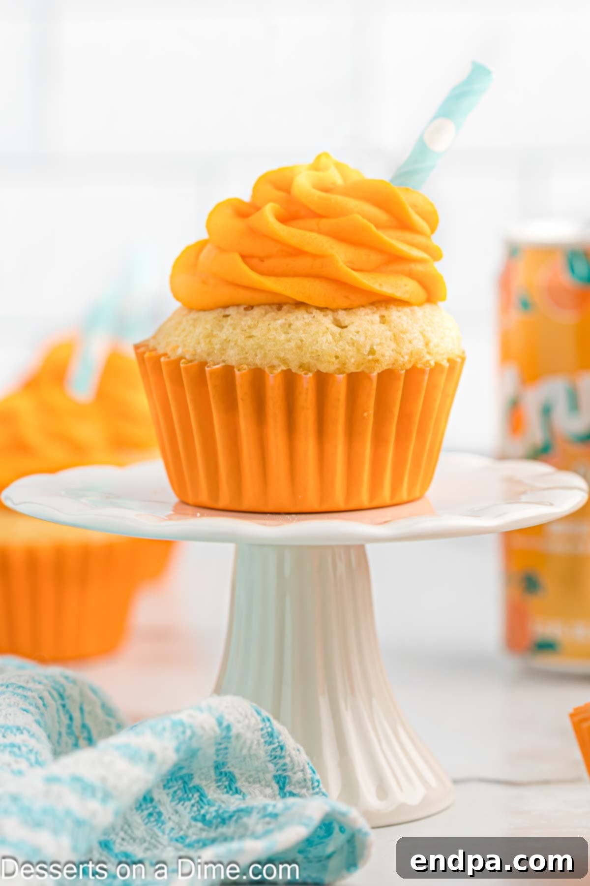 Cupcake with frosting on stand.