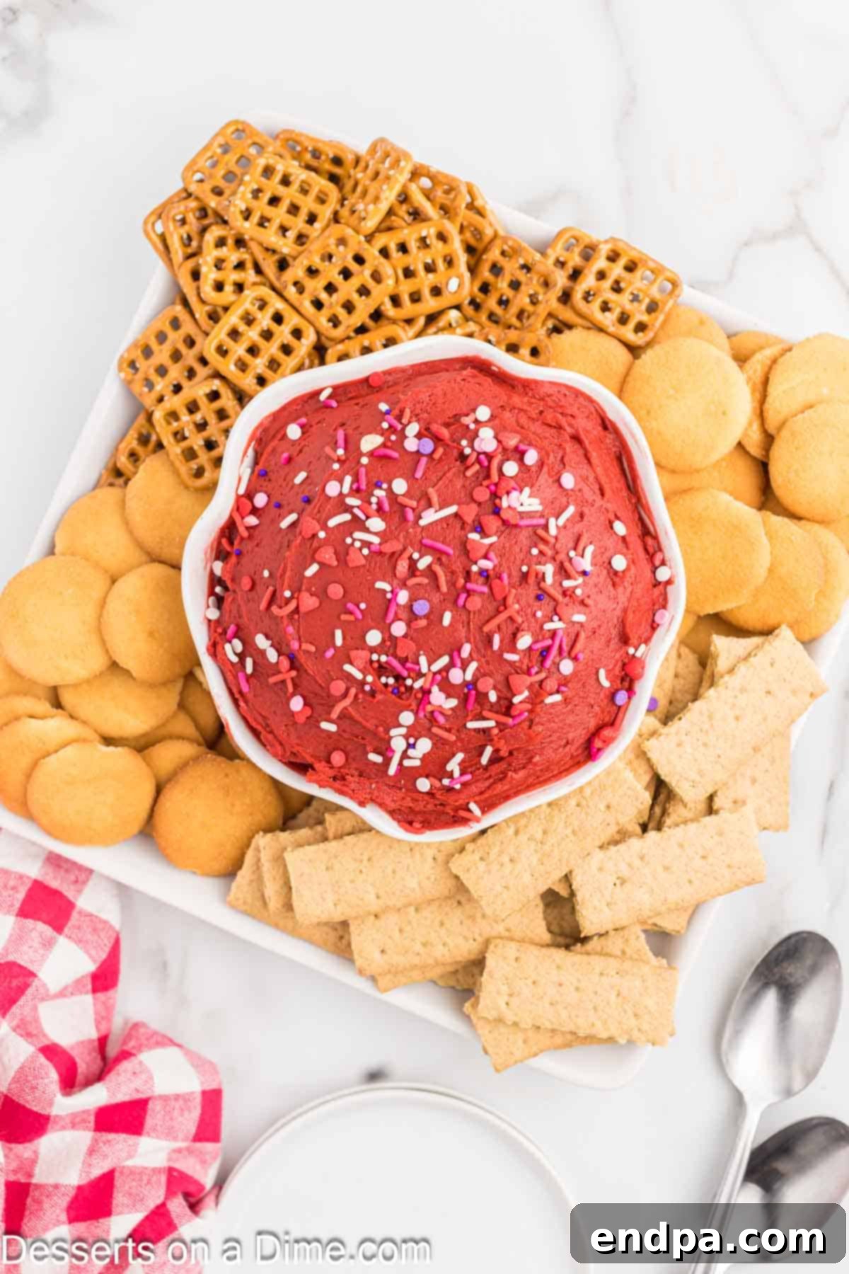 Red Velvet Delight Dip 7 The final Red Velvet Dip served in a beautiful bowl with an assortment of delicious dippers, ready for guests to enjoy.