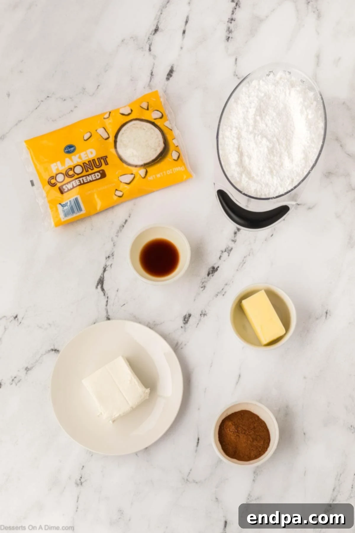 Ingredients for Irish potato candy: cinnamon, butter, cream cheese, vanilla, powdered sugar, coconut