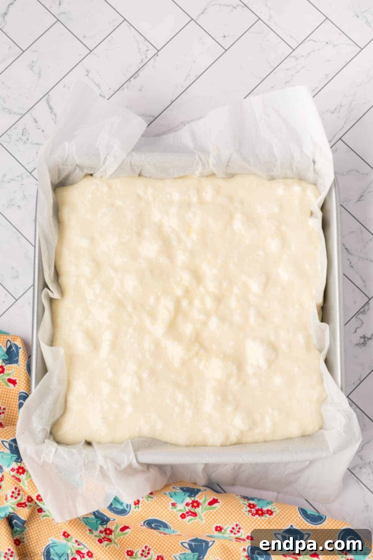 Enchanted Dessert 10 Batter spread into pan.