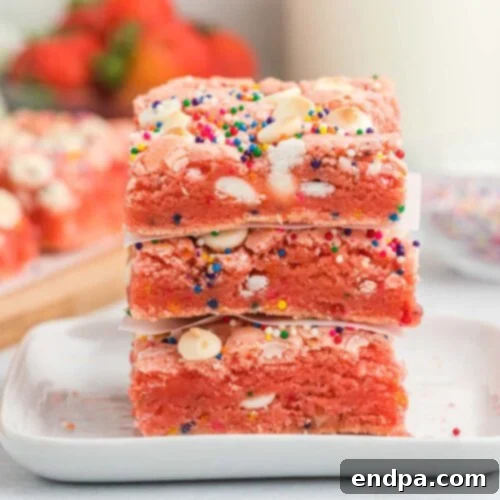 Strawberry Cake Mix Brownies stacked together.