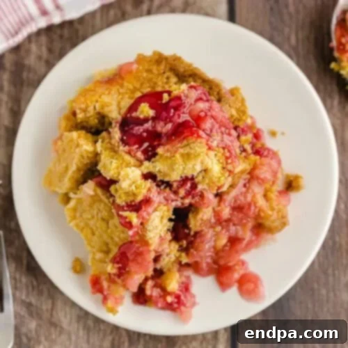 Cherry Pineapple Dump Cake on a white plate.