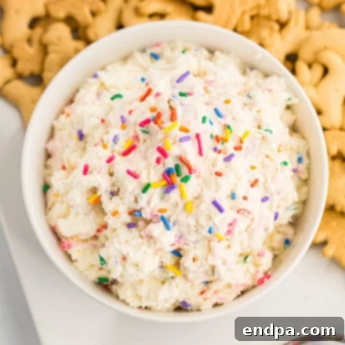Cake batter dip in a bowl with sprinkles.