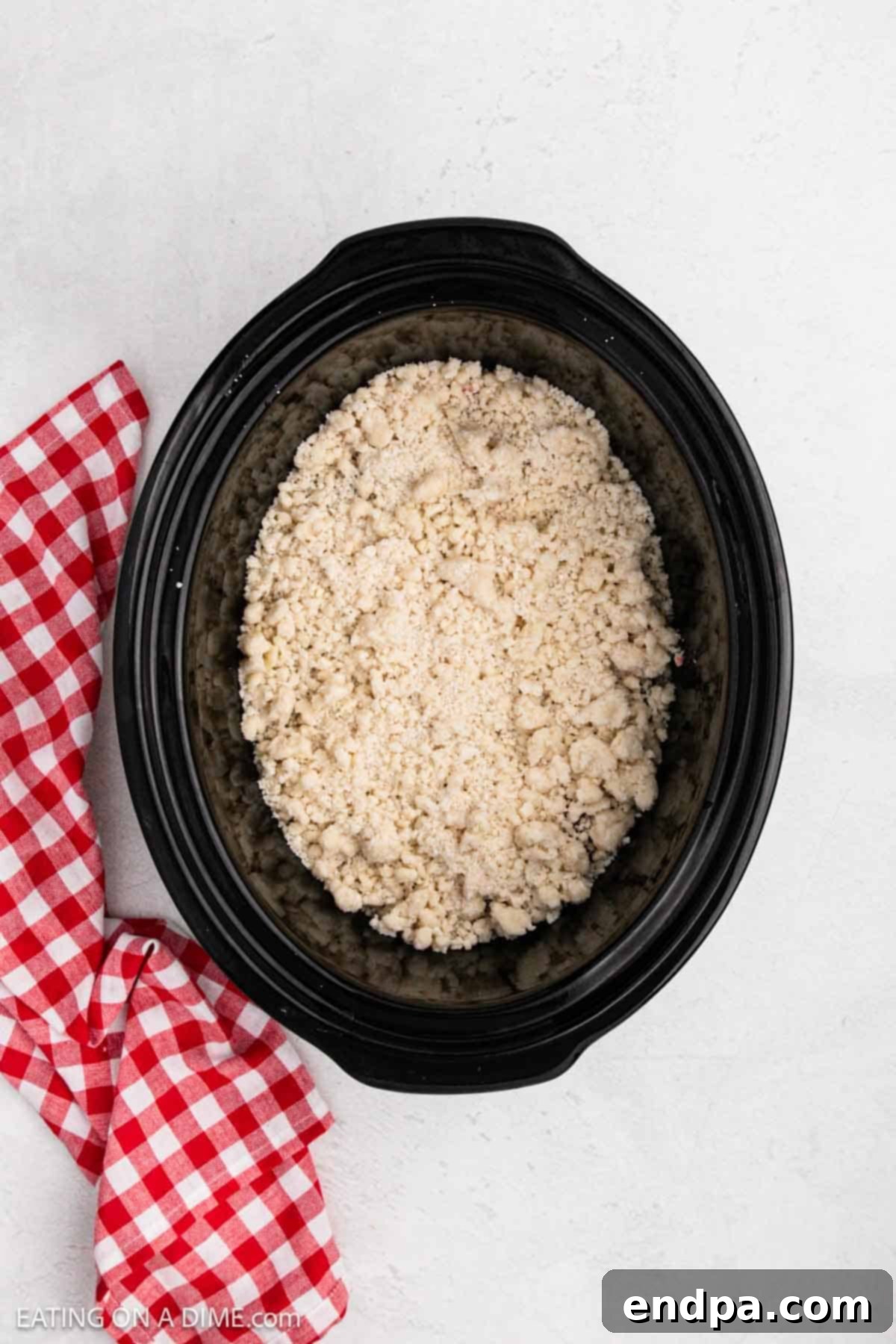 Cake mix and melted butter sprinkled on top of pie filling