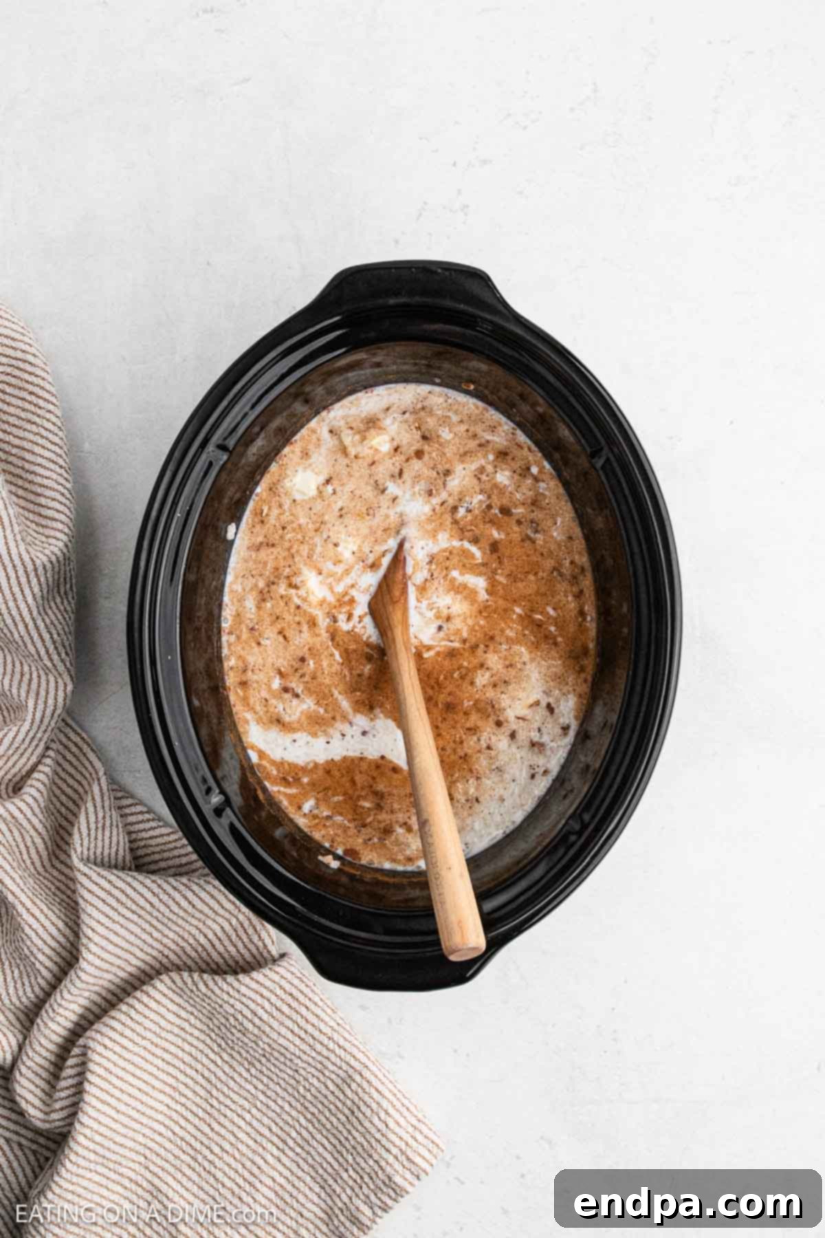 Sugar and milk combined in crock pot.