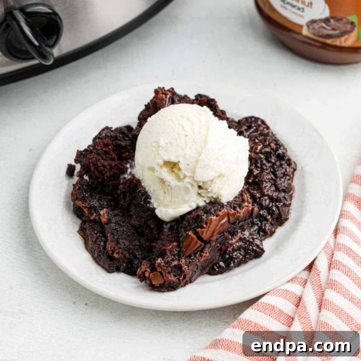 Crock Pot Chocolate Dump Cake topped with ice cream