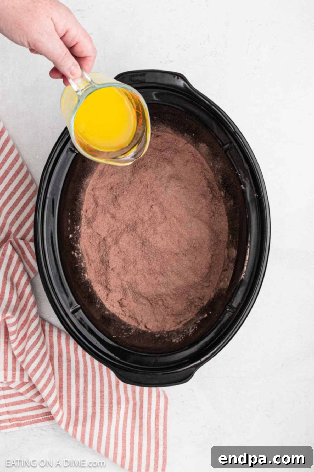 Melted butter poured over mix