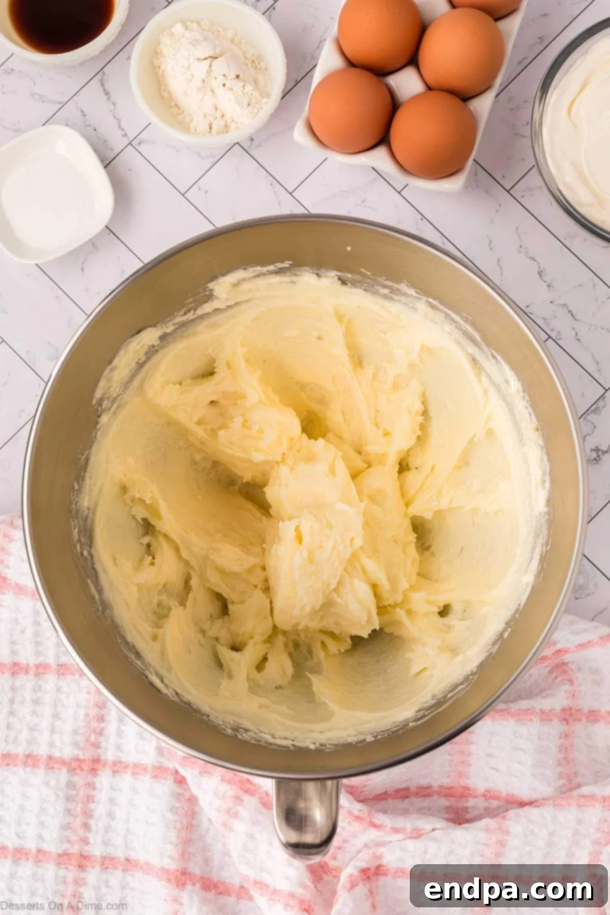 Slow Cooker Cheesecake 7 Cream cheese and sugar beat together until fluffy