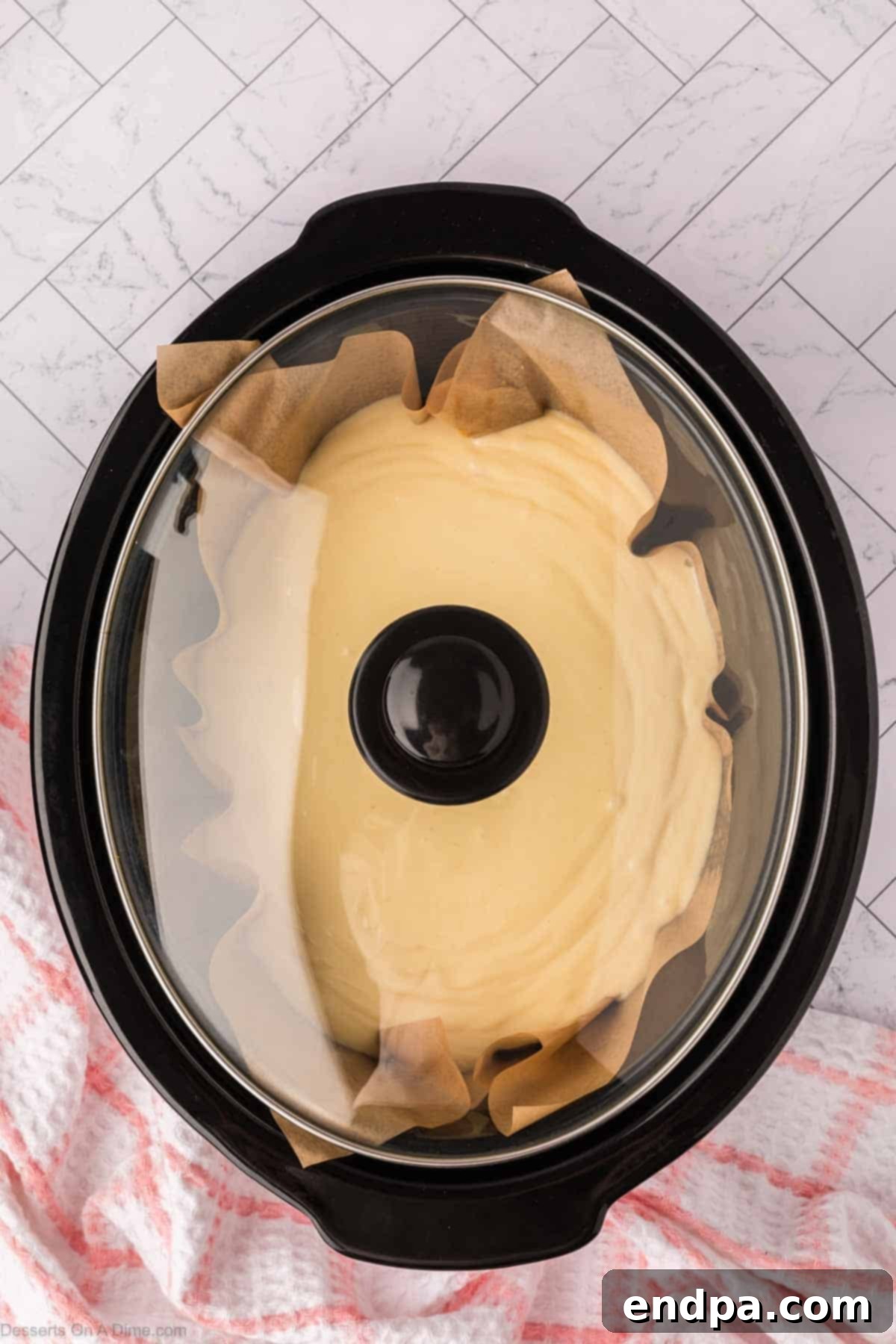 Slow Cooker Cheesecake 10 Lid placed on crock pot