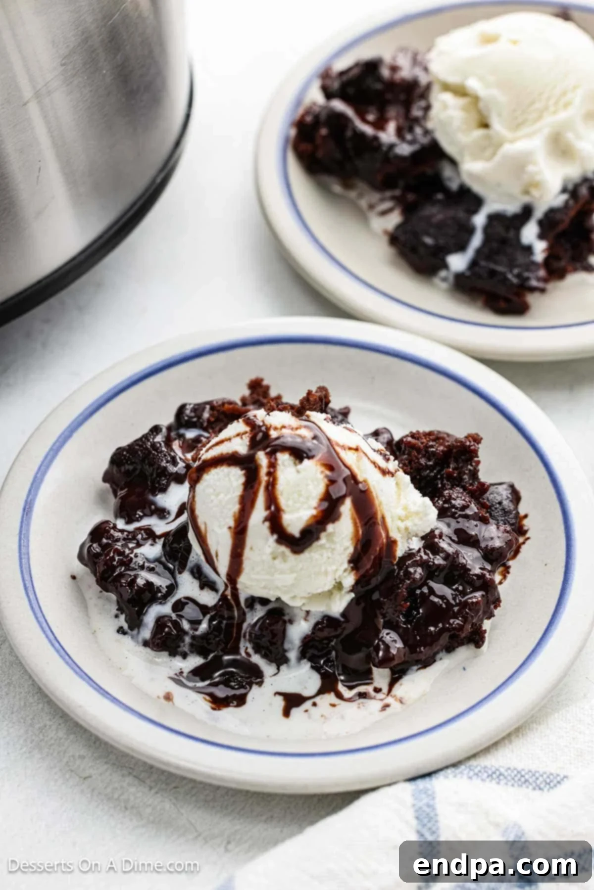 Slow Cooker Chocolate Fudge Brownies 10 Bowl with ice cream and brownie topped with chocolate syrup
