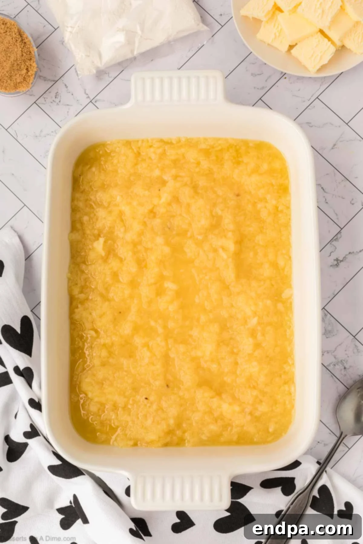 Crushed pineapple in baking dish. 