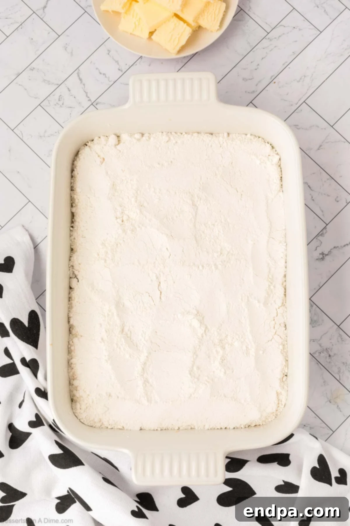 Cake mix spread over the top. 